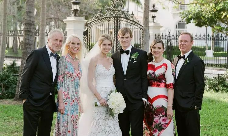 Kathleen McNulty Rooney with her husband Chris Mara (right), their son Connor Mara, his bride Chelsea and her parents.